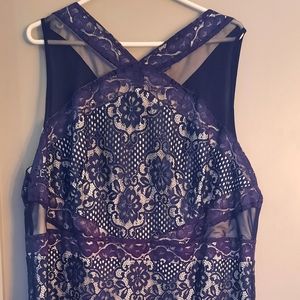 Knee length blue lace over white bodycon dress